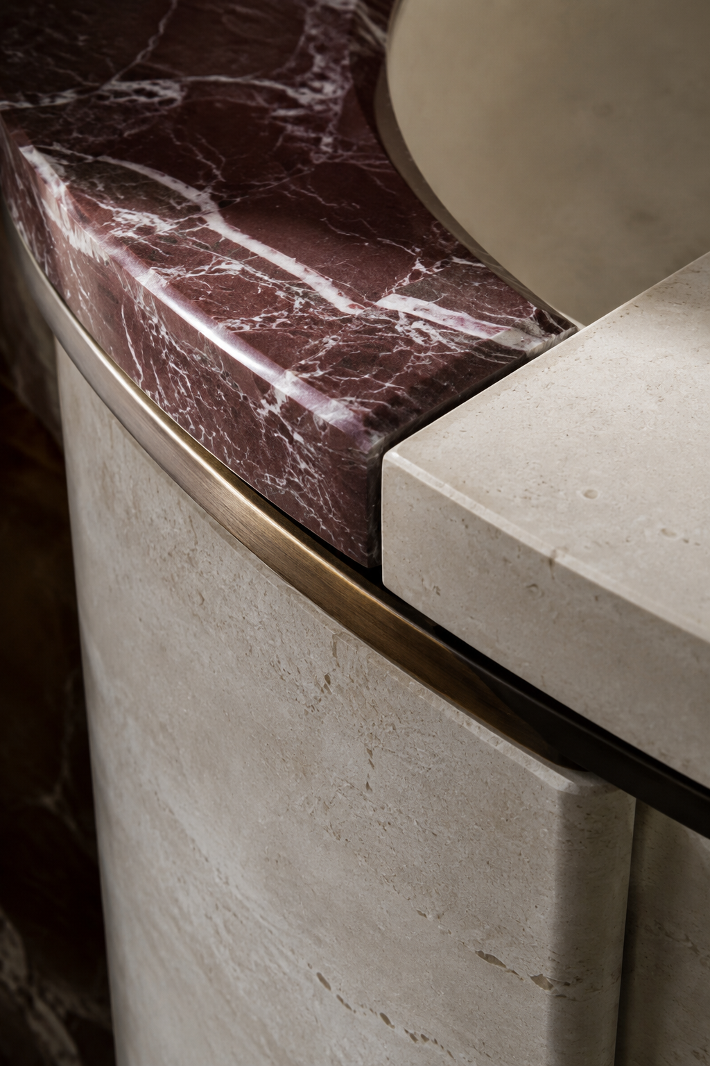 Curved red marble and limestone craftsmanship detail
